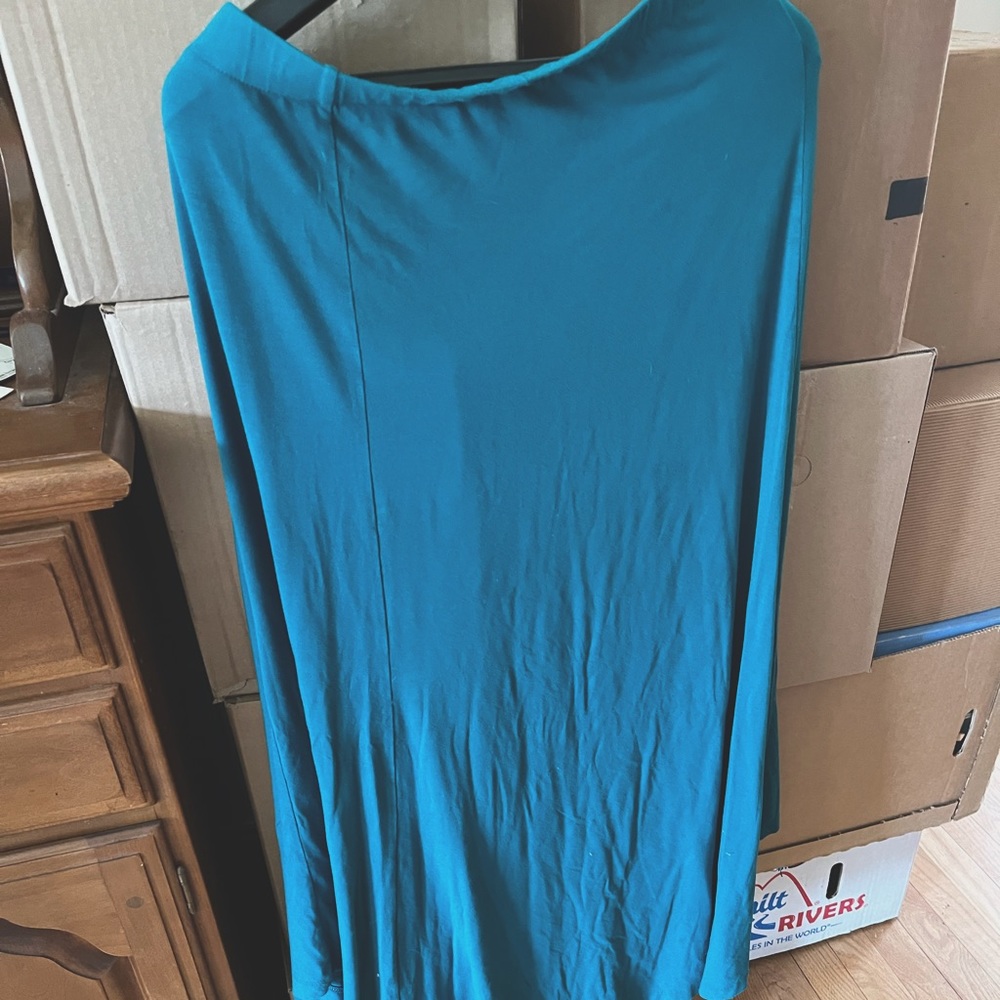 Beautiful full length maxi skirt. 95% rayon, 5% spandex.  Ample.